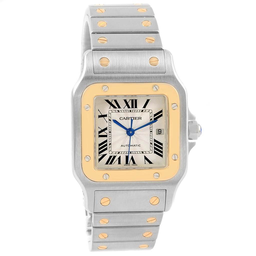 The image shows a front view of a Santos model Cartier watch, highlighting the face, bezel, and bracelet.