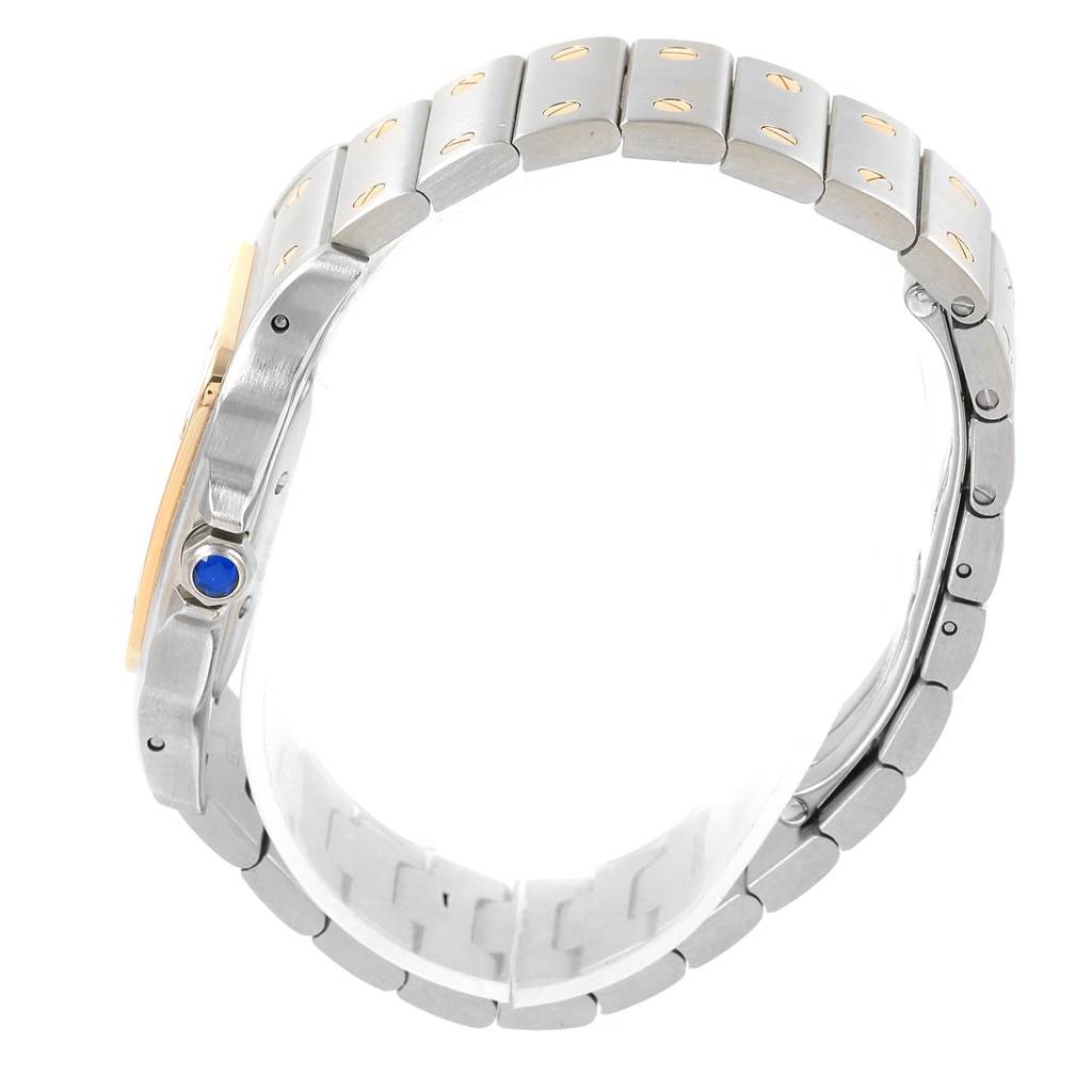 The image shows a side view of a Cartier Santos W20058C4 Men's Stainless Steel Silver Dial W20058C4 Men's Stainless Steel Silver Dial watch, highlighting its metal bracelet and blue cabochon crown.