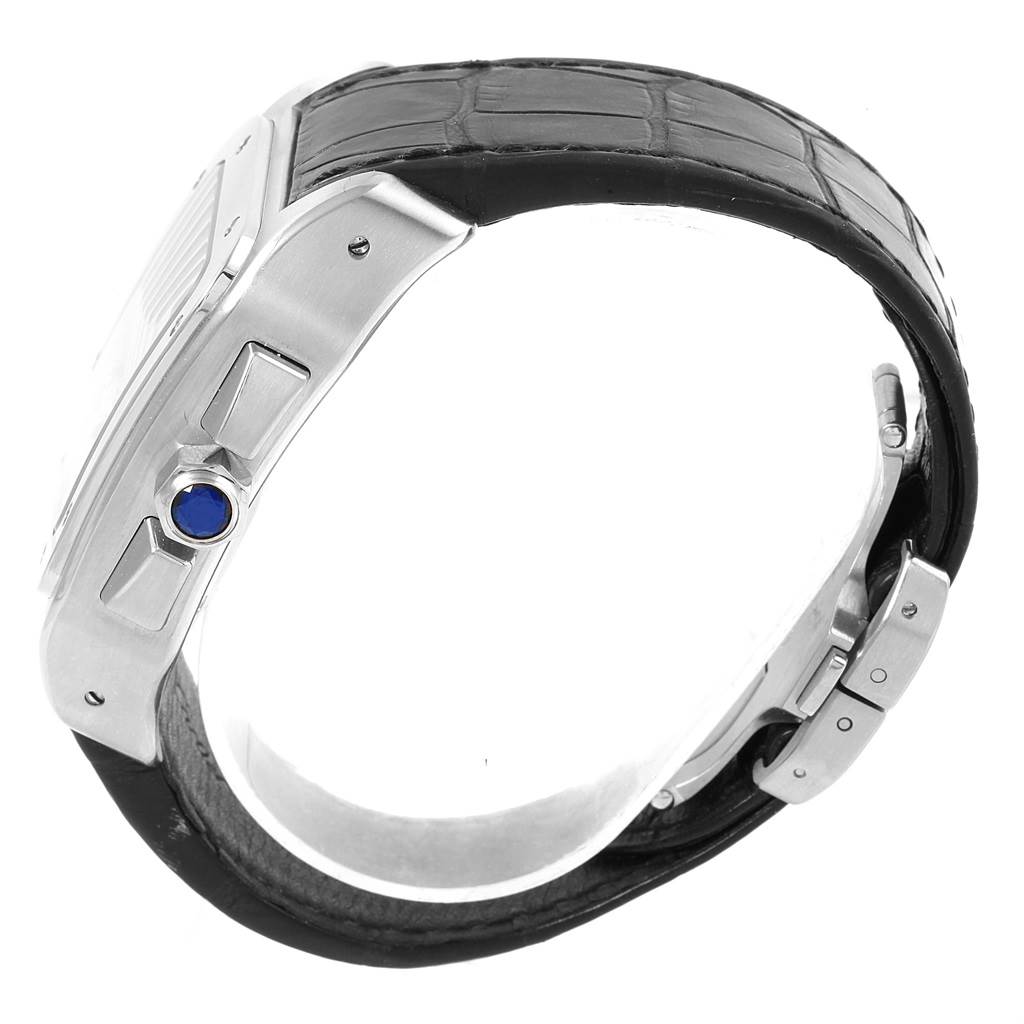 The image shows a side view of the Santos model watch by Cartier, highlighting the crown and part of the leather strap.
