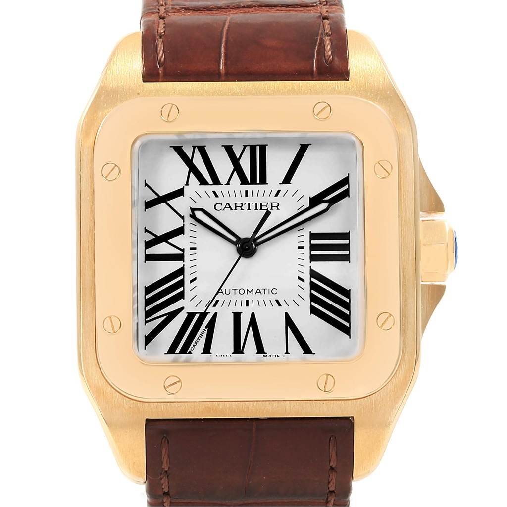 The image shows a front view of a Cartier Santos W20071Y1 Men's Yellow Gold Silver Dial W20071Y1 Men's Yellow Gold Silver Dial watch, highlighting its dial, gold case, and brown leather strap.