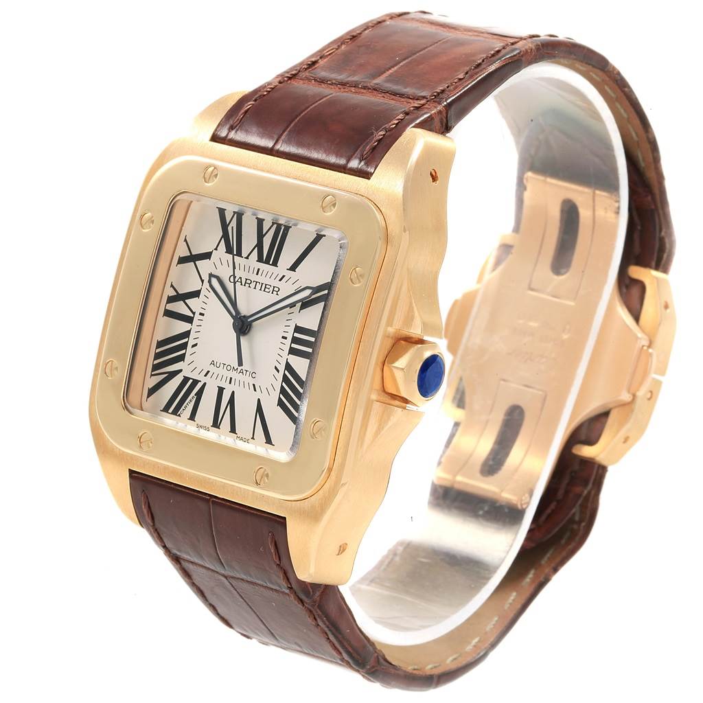 This image shows a Cartier Santos W20071Y1 Men's Yellow Gold Silver Dial W20071Y1 Men's Yellow Gold Silver Dial watch with a frontal angle highlighting its face, bezel, crown, and leather strap.