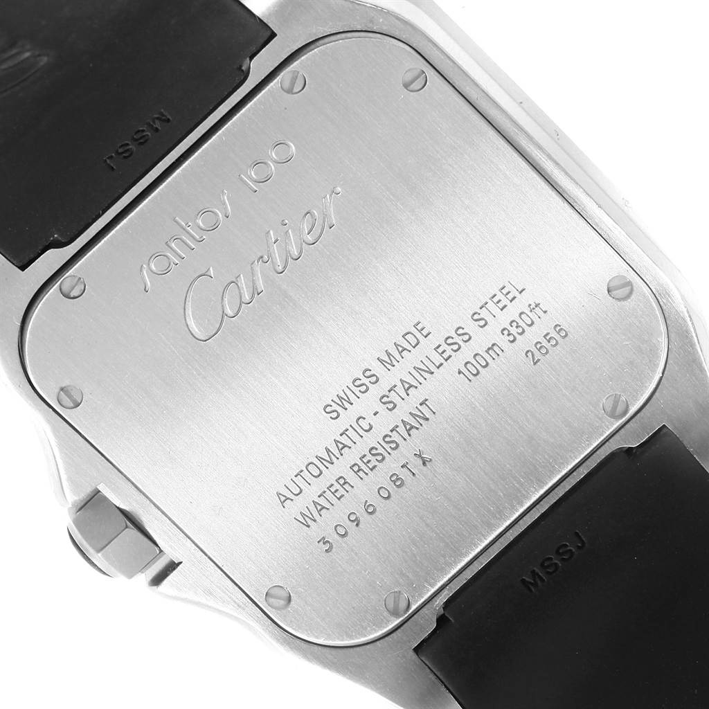 The image shows the back casing of a Cartier Santos W20121U2 Men
s Stainless Steel Silver Dial W20121U2 Men
s Stainless Steel Silver Dial 100 watch, displaying engravings and part of the strap.