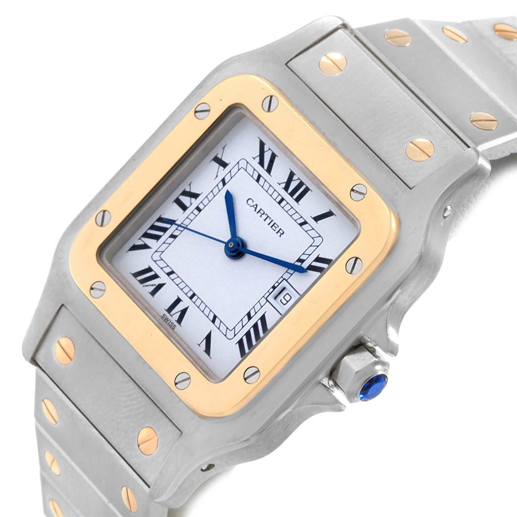 The Santos de Cartier watch is shown from an angled close-up, displaying the face, bezel, bracelet, and crown.