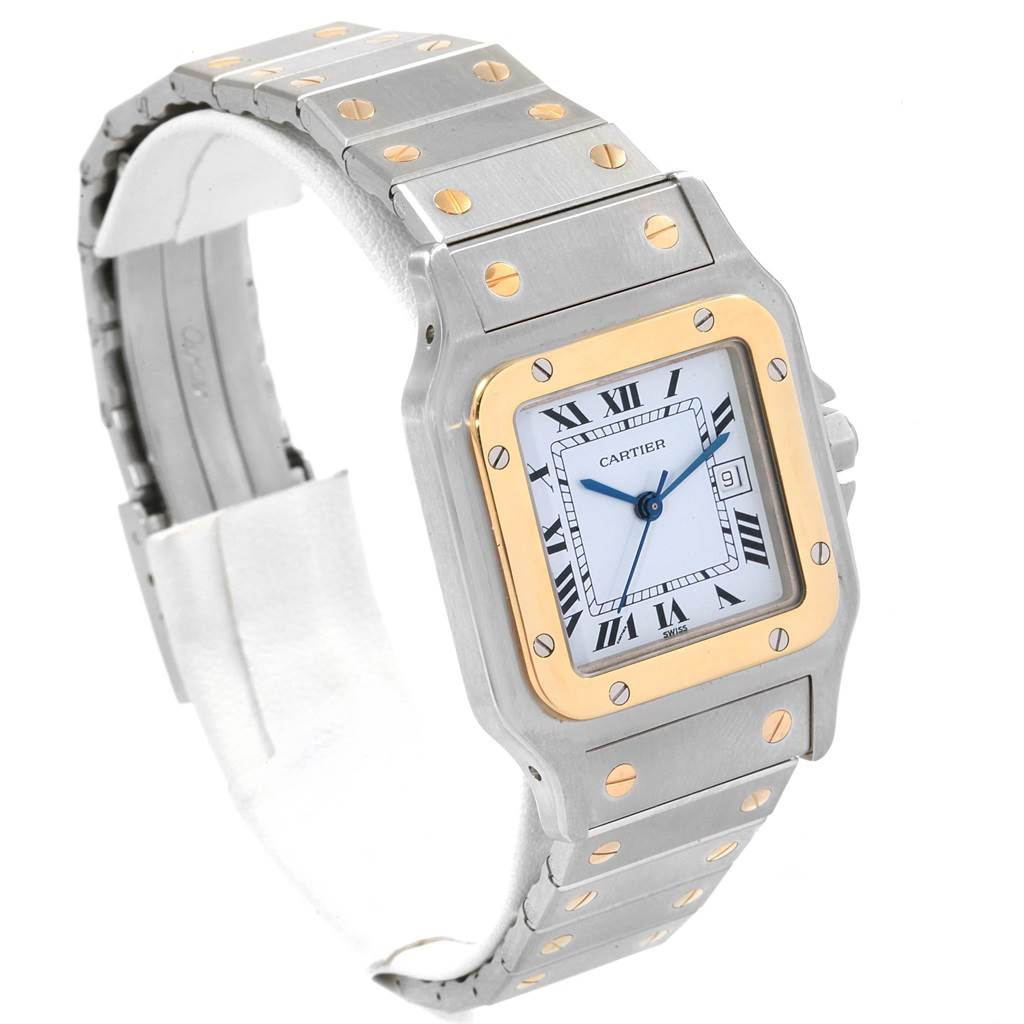 The image shows a Santos model Cartier watch from a front three-quarter angle, highlighting the face, bezel, and part of the band.