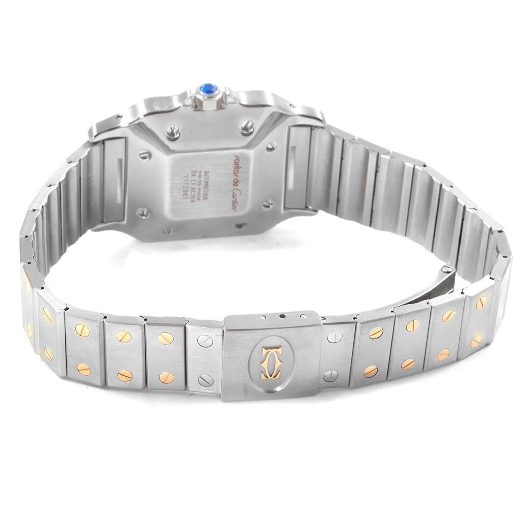 The image shows the back of the Cartier Santos 1172961 Men
s Stainless Steel White Dial 1172961 Men
s Stainless Steel White Dial watch and its metal bracelet with gold accents.