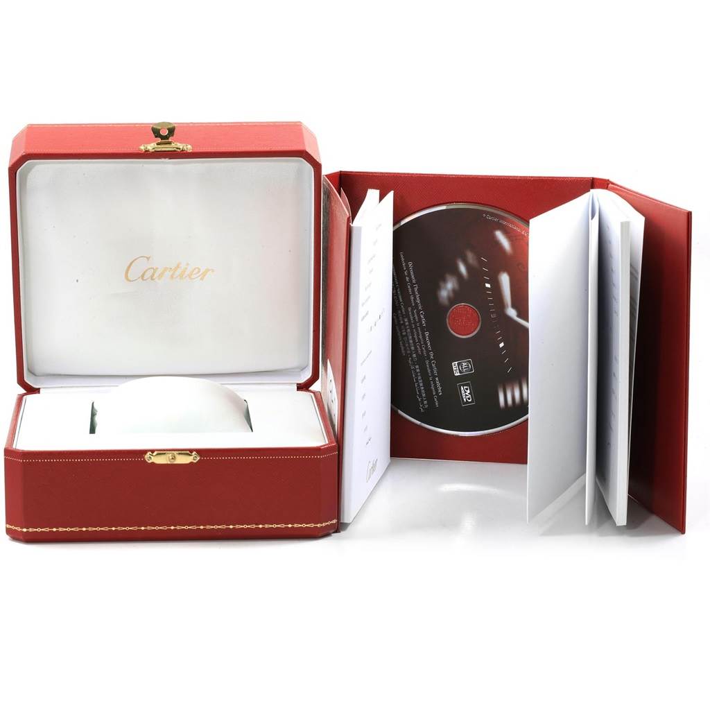 The image shows the Cartier Santos W20073X8 Men's Stainless Steel Silver Dial W20073X8 Men's Stainless Steel Silver Dial watch packaging, including the watch box, a DVD, and accompanying booklets.