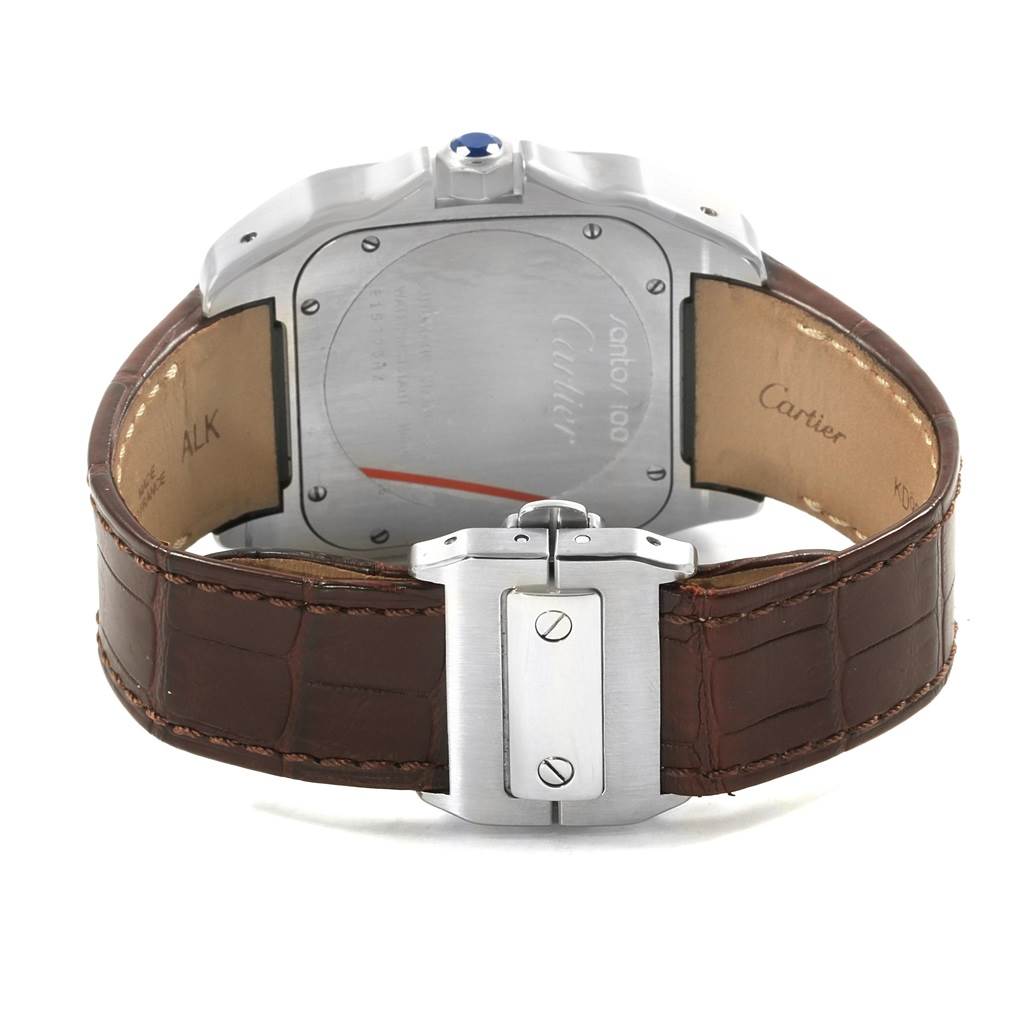 The image shows the Cartier Santos W20073X8 Men's Stainless Steel Silver Dial W20073X8 Men's Stainless Steel Silver Dial watch's back case, crown, and brown leather strap with buckle closure.