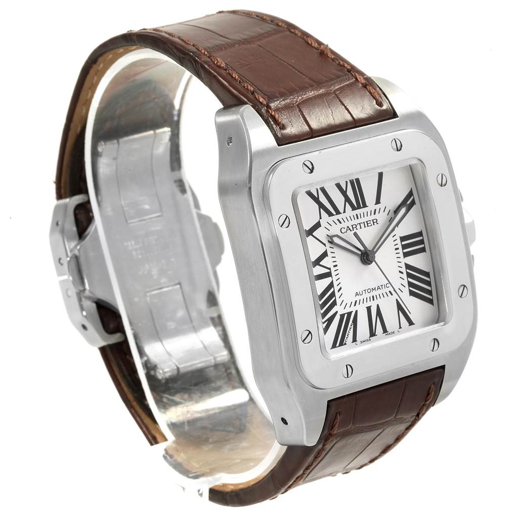 This is a Cartier Santos W20073X8 Men's Stainless Steel Silver Dial W20073X8 Men's Stainless Steel Silver Dial watch angled to show its face, bezel, and part of the brown leather strap.