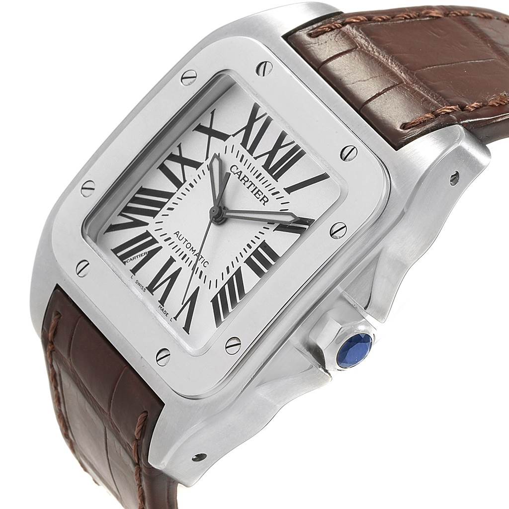 The image shows the face and right side of a Cartier Santos W20073X8 Men's Stainless Steel Silver Dial W20073X8 Men's Stainless Steel Silver Dial watch, highlighting its bezel, dial, crown, and leather strap.