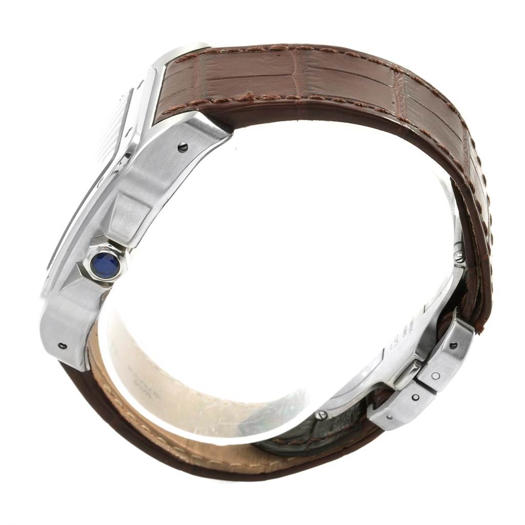 The image shows a side view of the Santos model by Cartier, featuring the crown and partial brown leather strap.