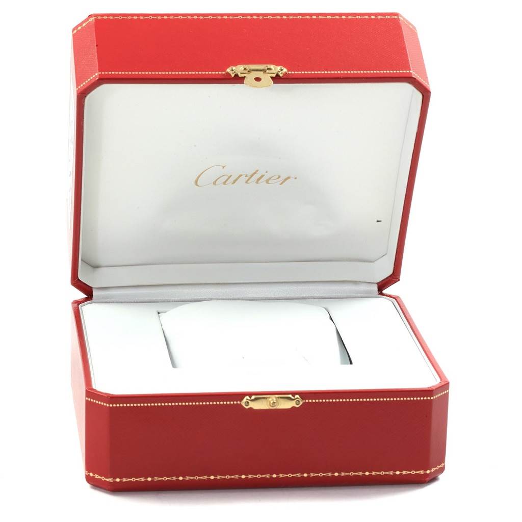 The image shows an open red Cartier watch box, presumably for the Santos model, with a white interior cushion.