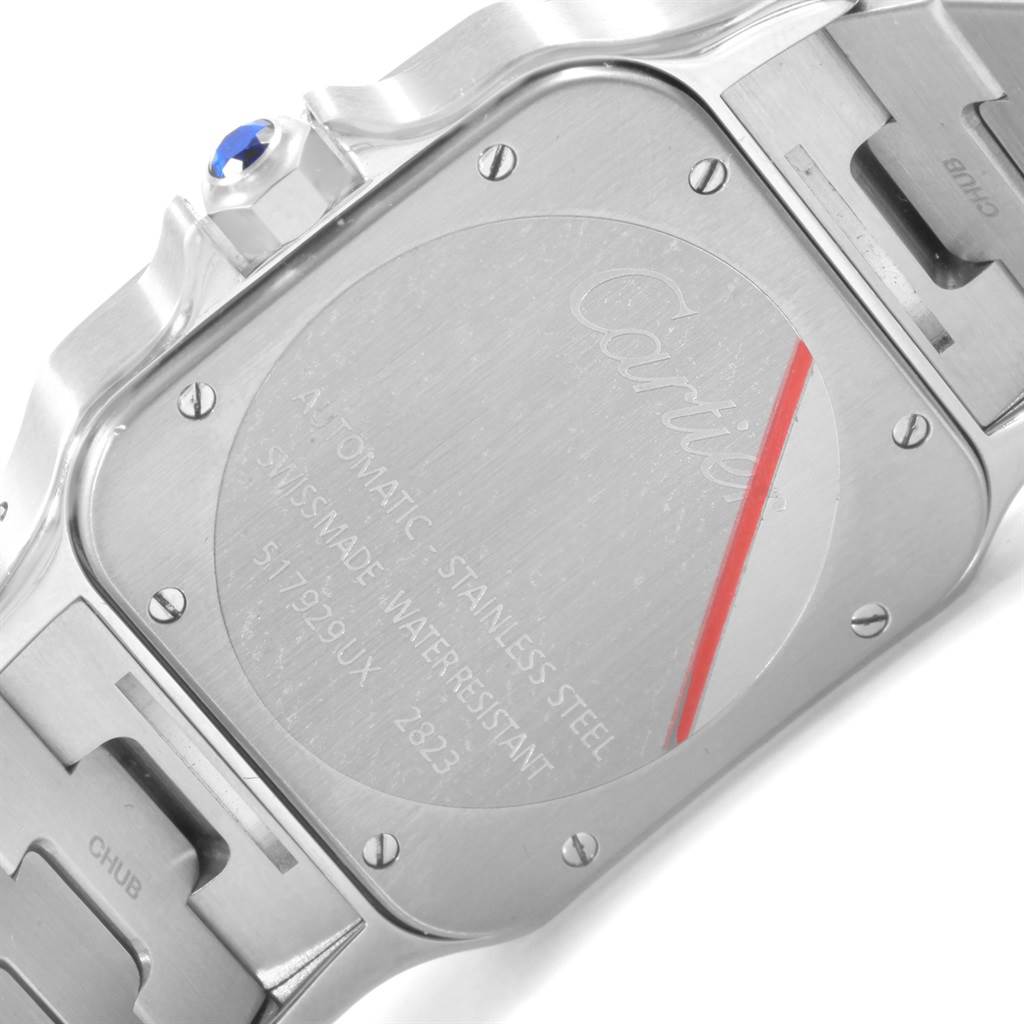 This image shows the back case and part of the stainless steel bracelet of a Santos model by Cartier.