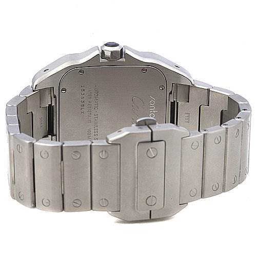 The image shows the back of a Santos model watch by Cartier, focusing on the case back and metal bracelet.