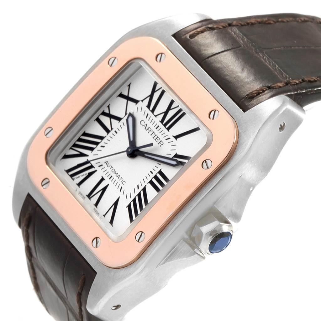 The image shows a Cartier Santos W20107X7 Men
s Stainless Steel Silver Dial W20107X7 Men
s Stainless Steel Silver Dial watch at an angle, featuring its face, bezel, crown, and partial leather strap.