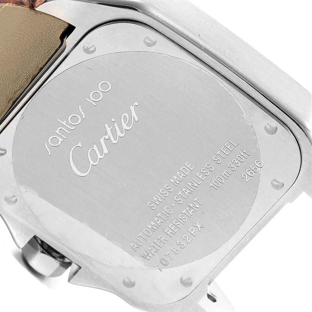 This image shows the case back of a Santos 100 Cartier watch, highlighting its engravings and stainless steel material.