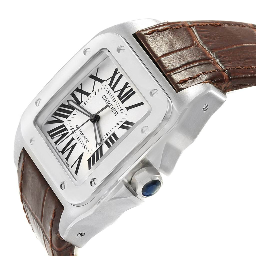 This is a Cartier Santos W20073X8 Men
s Stainless Steel Silver Dial W20073X8 Men
s Stainless Steel Silver Dial watch showcasing its face, bezel, crown, and part of the leather strap at an oblique angle.