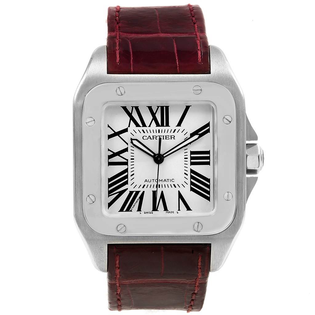 The image shows a front view of the Cartier Santos W20073X8 Men's Stainless Steel Silver Dial W20073X8 Men's Stainless Steel Silver Dial watch, displaying its square dial, Roman numerals, and a red leather strap.