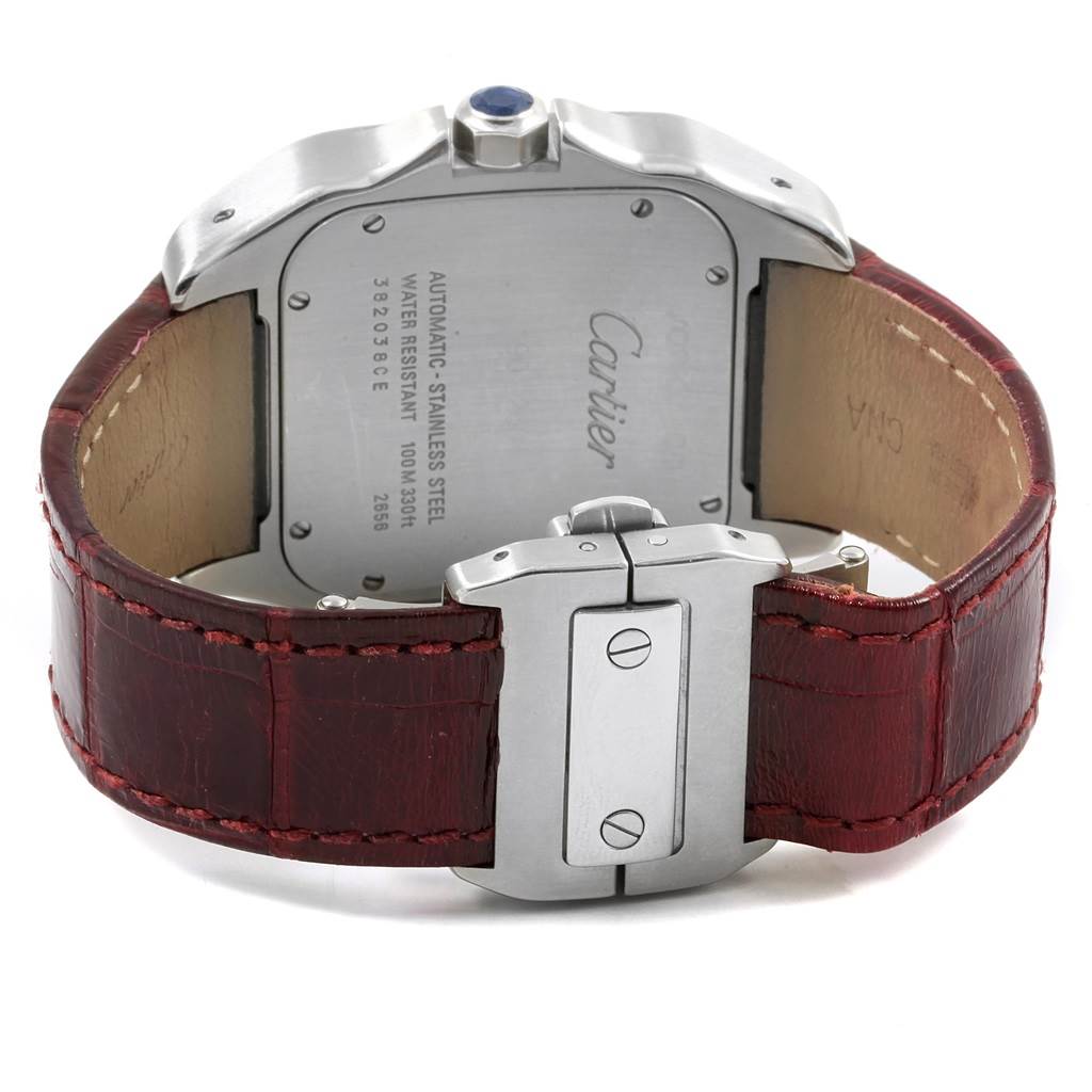 The image shows the back view of a Cartier Santos W20073X8 Men's Stainless Steel Silver Dial W20073X8 Men's Stainless Steel Silver Dial watch, highlighting its case back, crown, and red leather strap with a clasp.