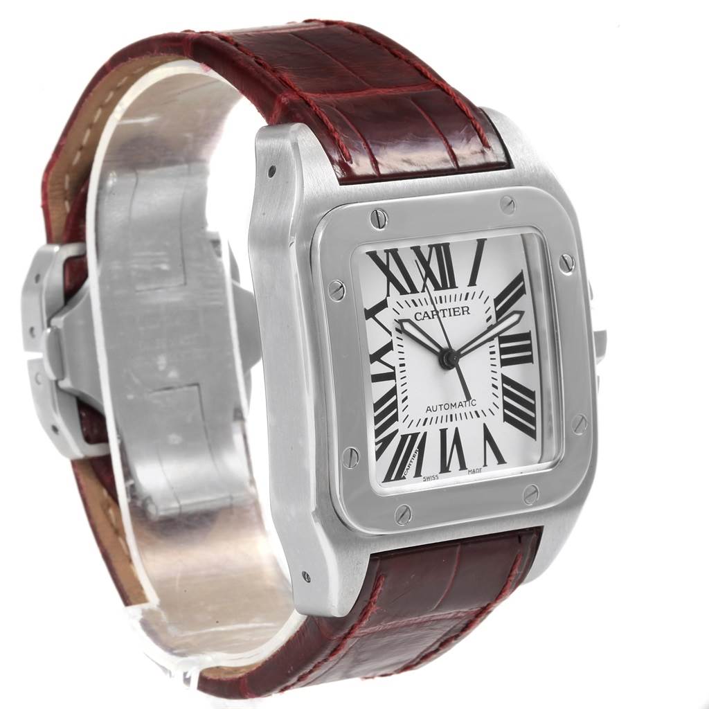 The Cartier Santos W20073X8 Men's Stainless Steel Silver Dial W20073X8 Men's Stainless Steel Silver Dial watch is shown at an angle, highlighting its face, bezel, and leather strap.