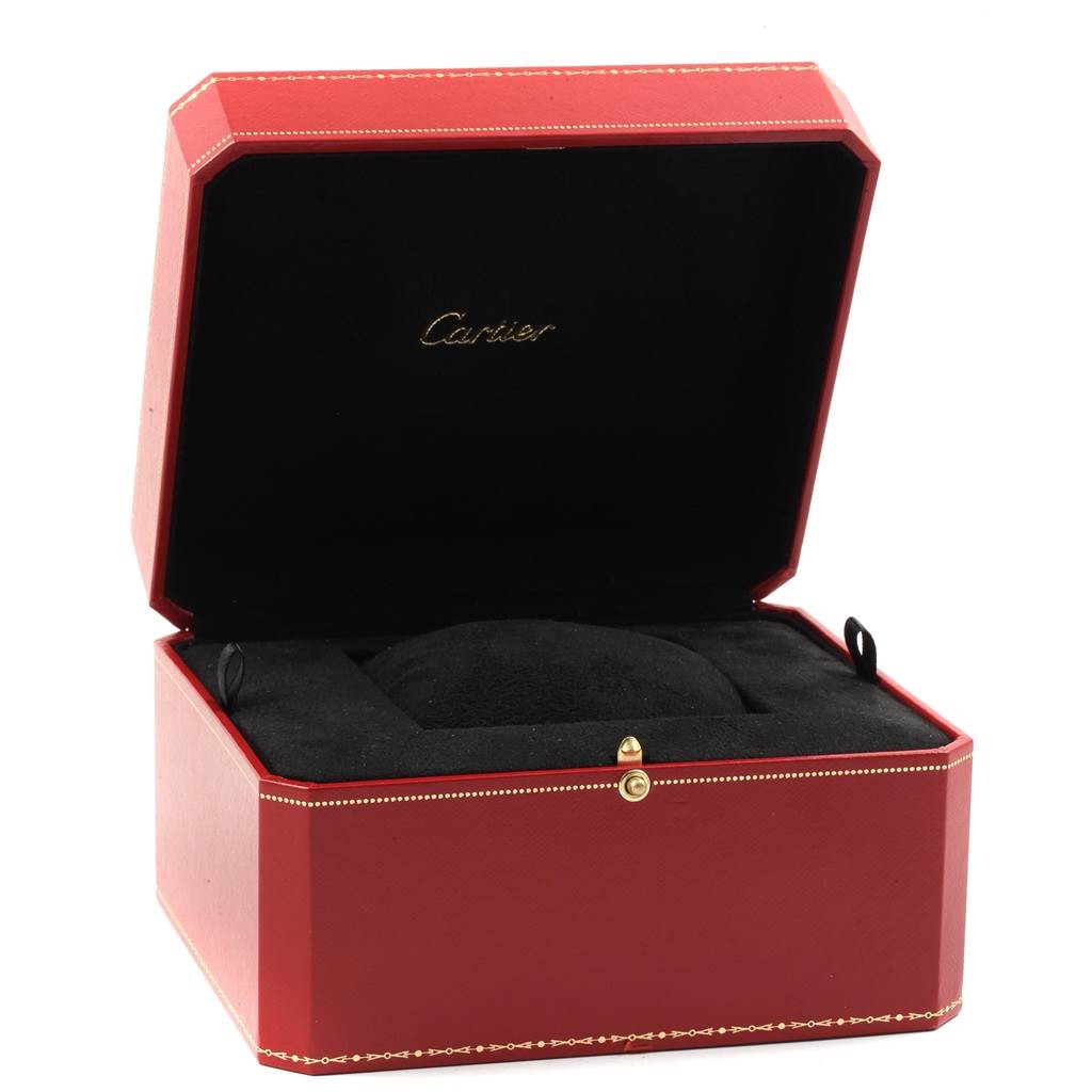 The image shows an open red Cartier Santos W20098D6 Men
s Stainless Steel Silver Dial W20098D6 Men
s Stainless Steel Silver Dial watch box with black interior, seen from the front angle.