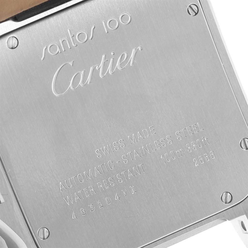 The image shows the back case of a Cartier Santos W20073X8 Men's Stainless Steel Silver Dial W20073X8 Men's Stainless Steel Silver Dial 100 watch, displaying engravings and screws.