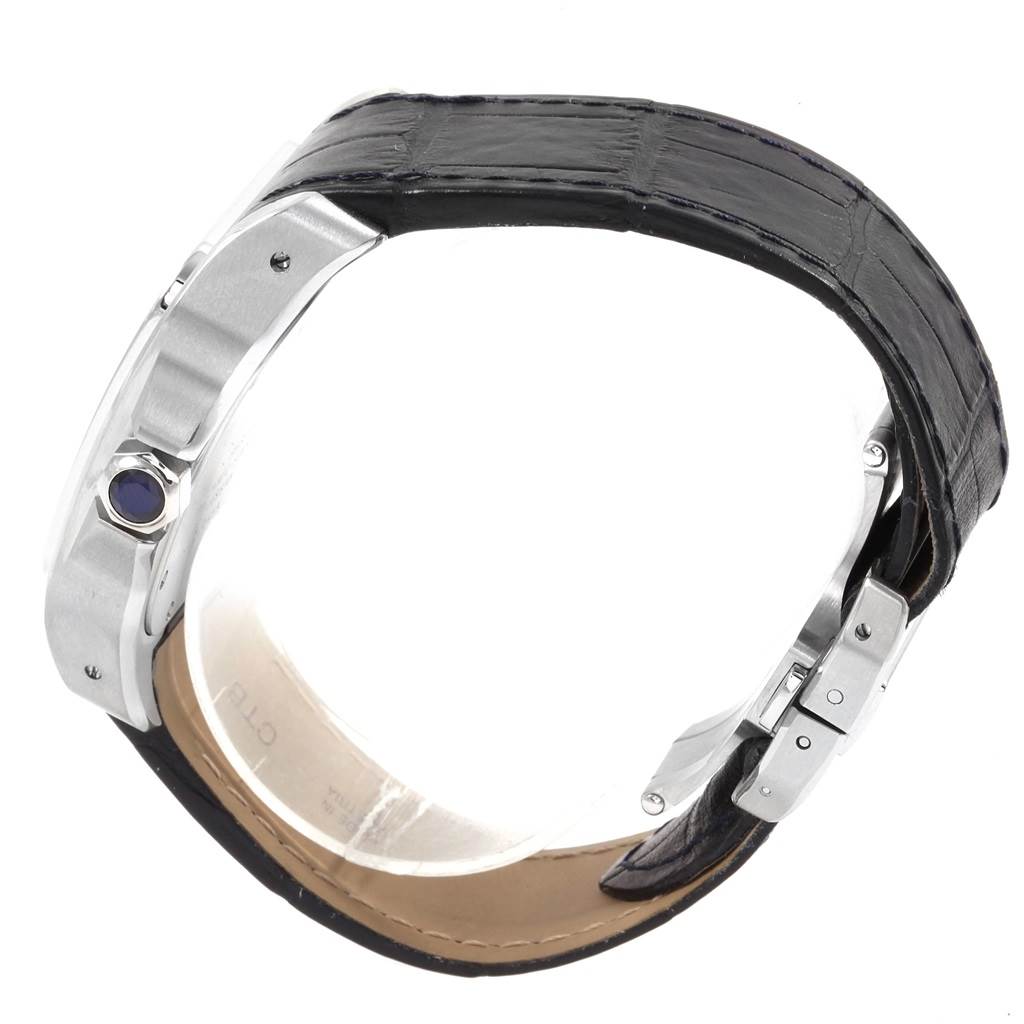 The image shows a side view of the Santos model by Cartier, highlighting its crown and leather strap with clasp.
