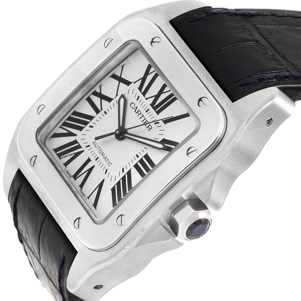 The image shows an angled view of the Cartier Santos W20073X8 Men's Stainless Steel Silver Dial W20073X8 Men's Stainless Steel Silver Dial watch, highlighting the dial, bezel, crown, and part of the leather strap.