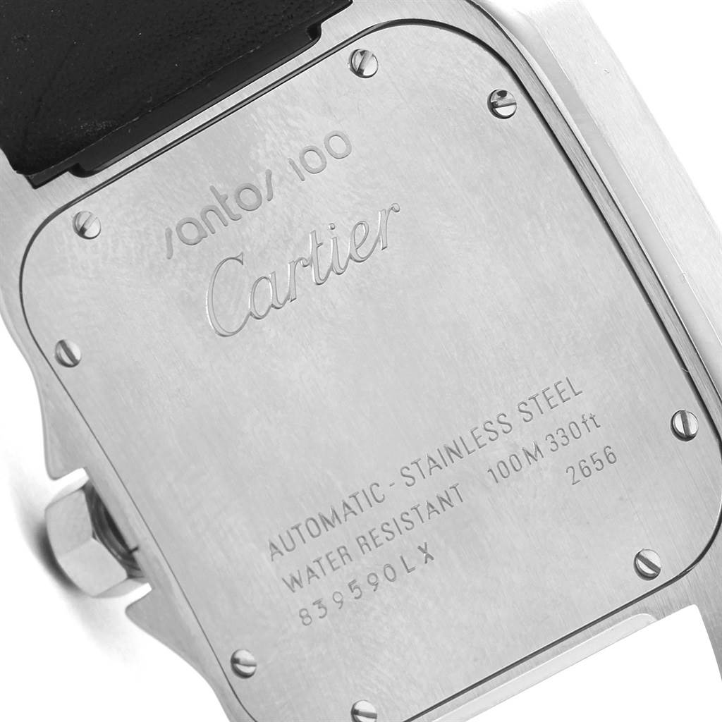 This image shows the back case of the Santos 100 model by Cartier, highlighting its engravings and stainless steel screws.