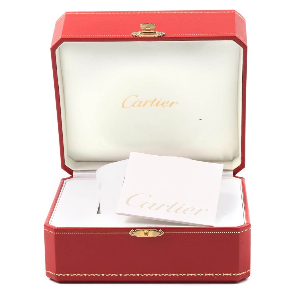 The image shows an open Cartier Santos W20073X8 Men's Stainless Steel Silver Dial W20073X8 Men's Stainless Steel Silver Dial watch box with a Cartier booklet inside.