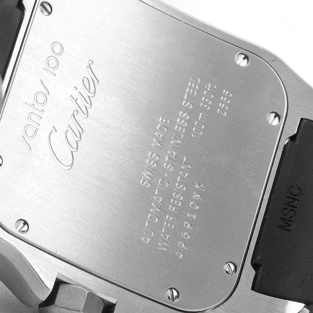 The image shows the case back of a Santos model by Cartier, featuring engravings and screws.