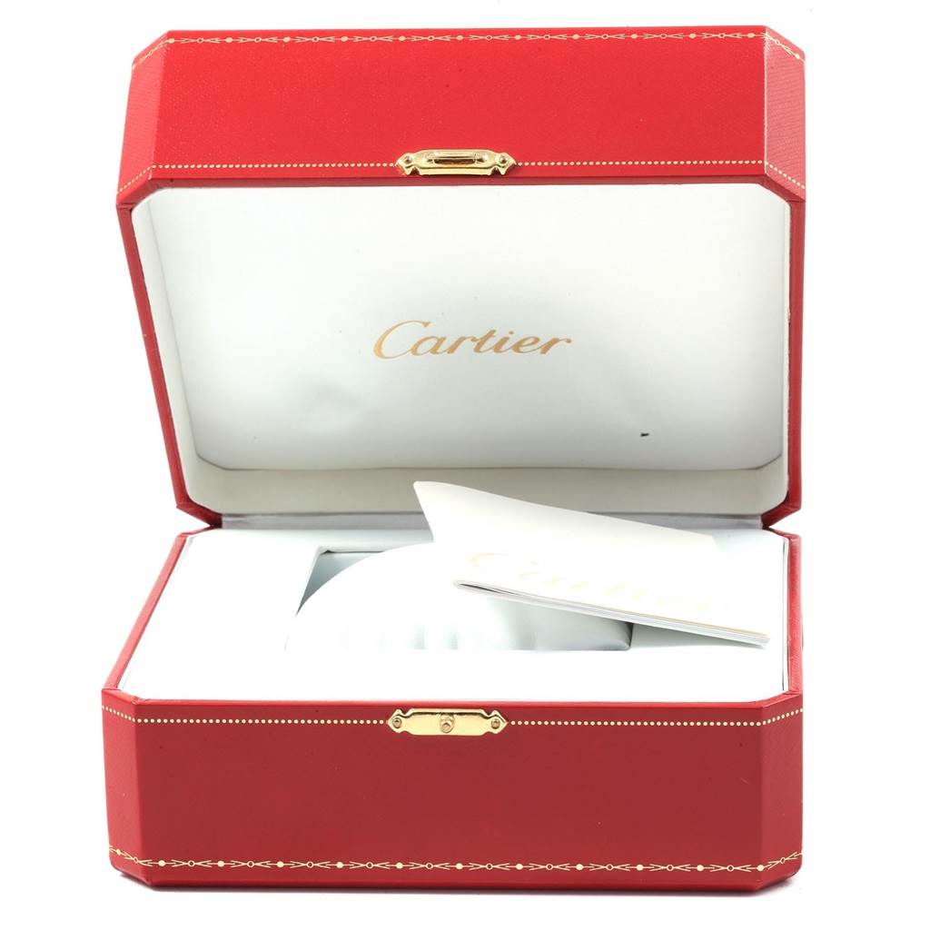 The image shows an open red Cartier box for the Santos model, with a pillow and a booklet inside.
