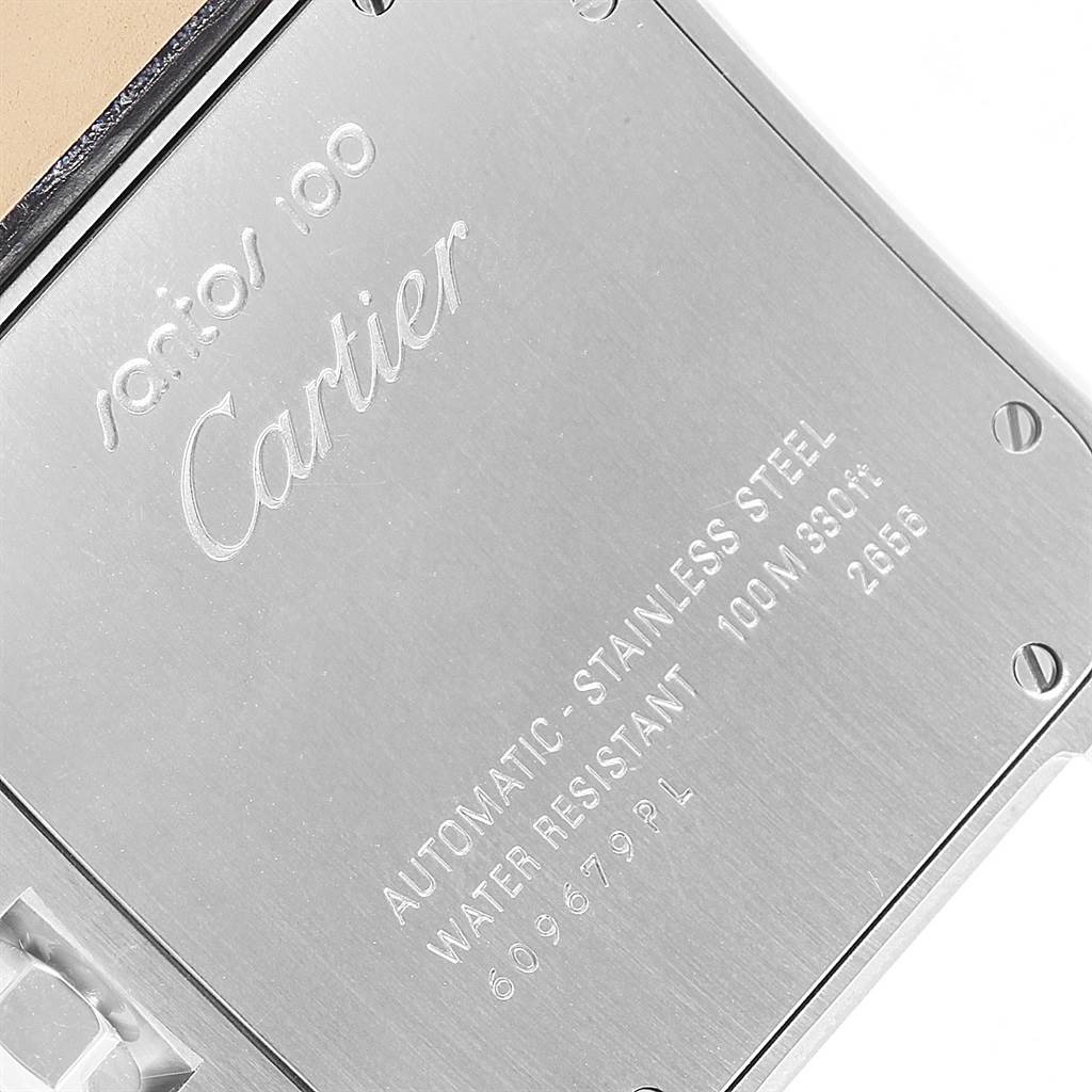 This image shows the back case of a Santos model watch by Cartier, highlighting the brand engraving and specifications.