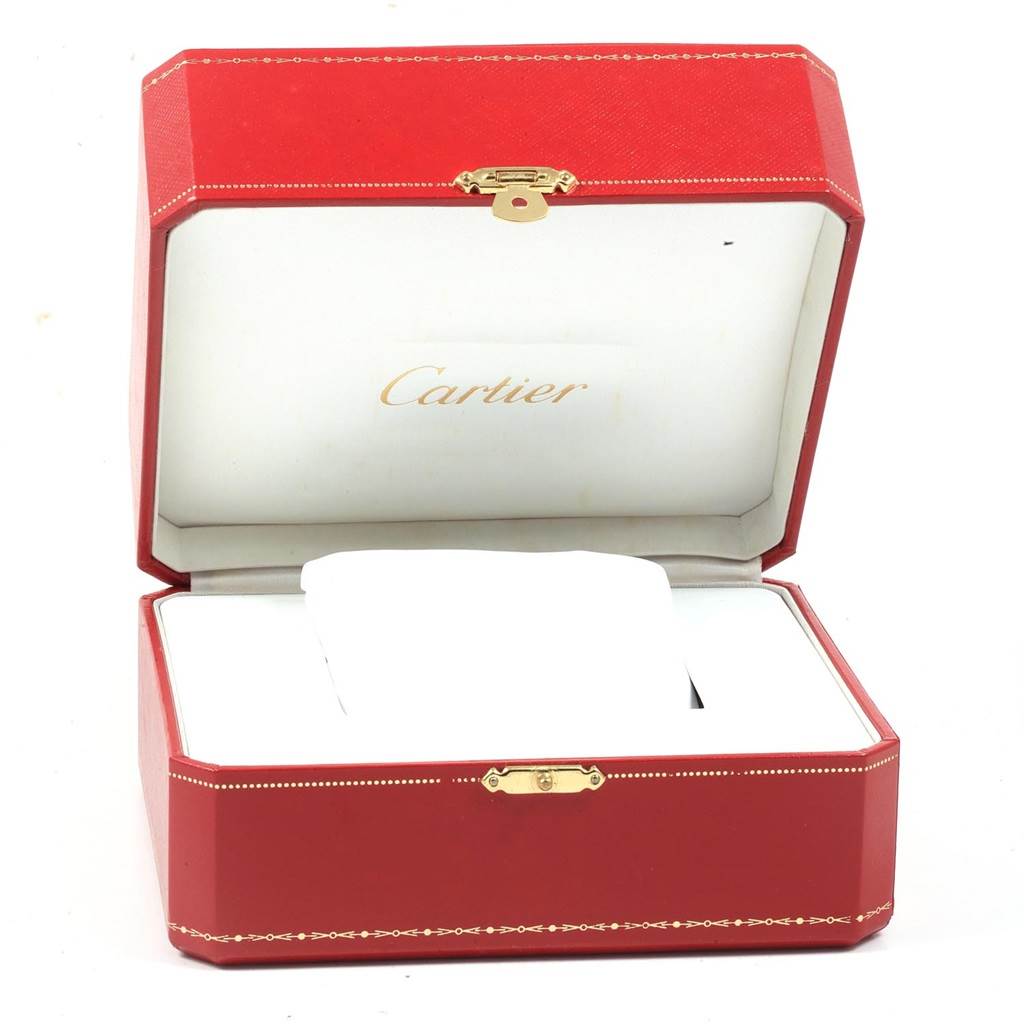 The image shows an open Cartier Santos W20099C4 Men's Stainless Steel Silver Dial W20099C4 Men's Stainless Steel Silver Dial watch box, angled from the front, displaying the padded interior and logo.