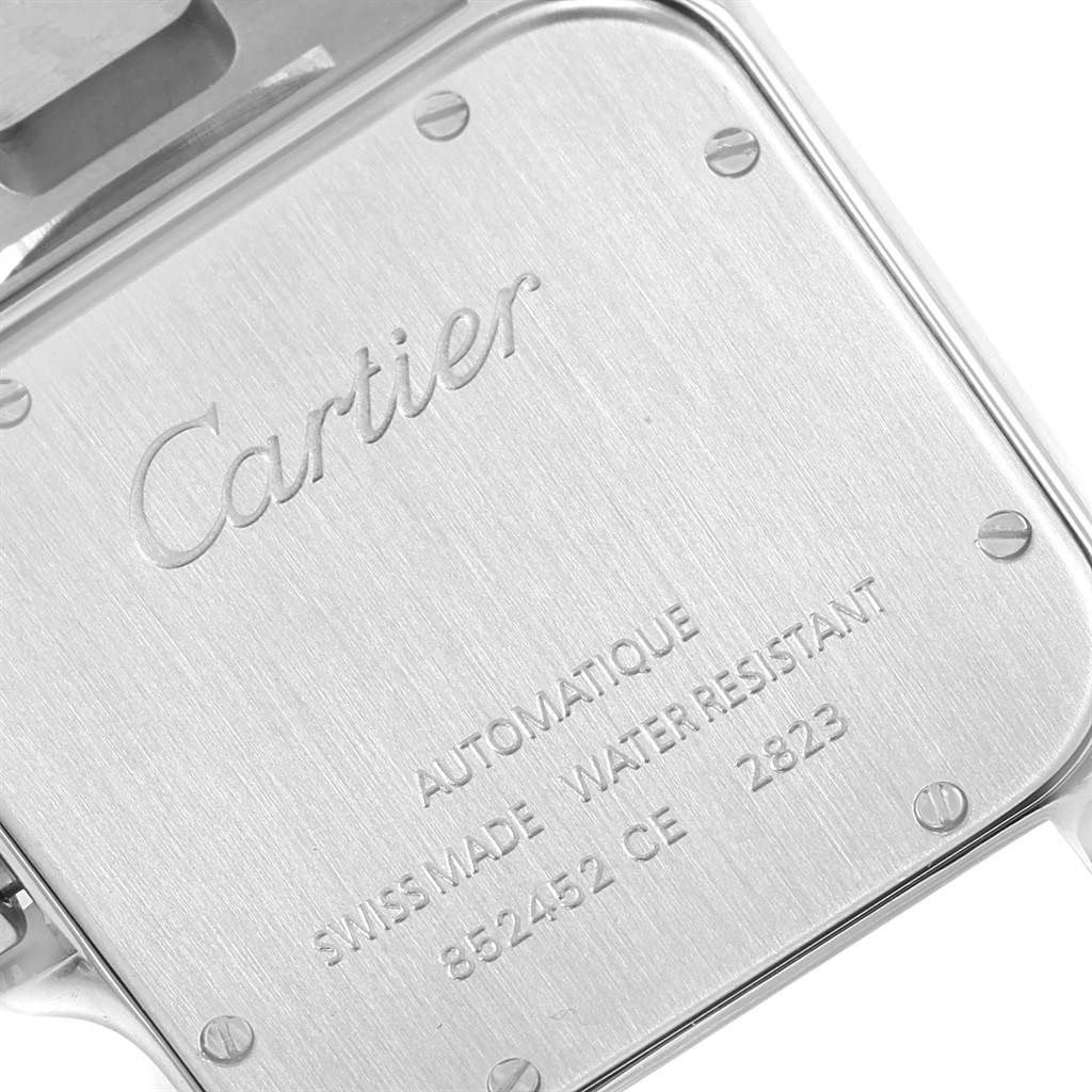 The image shows the case back of a Cartier Santos W20099C4 Men's Stainless Steel Silver Dial W20099C4 Men's Stainless Steel Silver Dial watch, displaying the brand name and specifications.