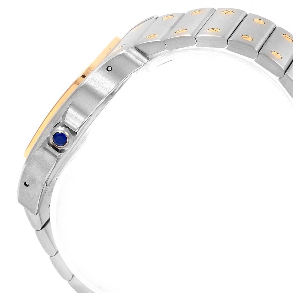 The image shows a side view of the Cartier Santos W20099C4 Men's Stainless Steel Silver Dial W20099C4 Men's Stainless Steel Silver Dial watch, focusing on its bracelet and crown with a blue gemstone.