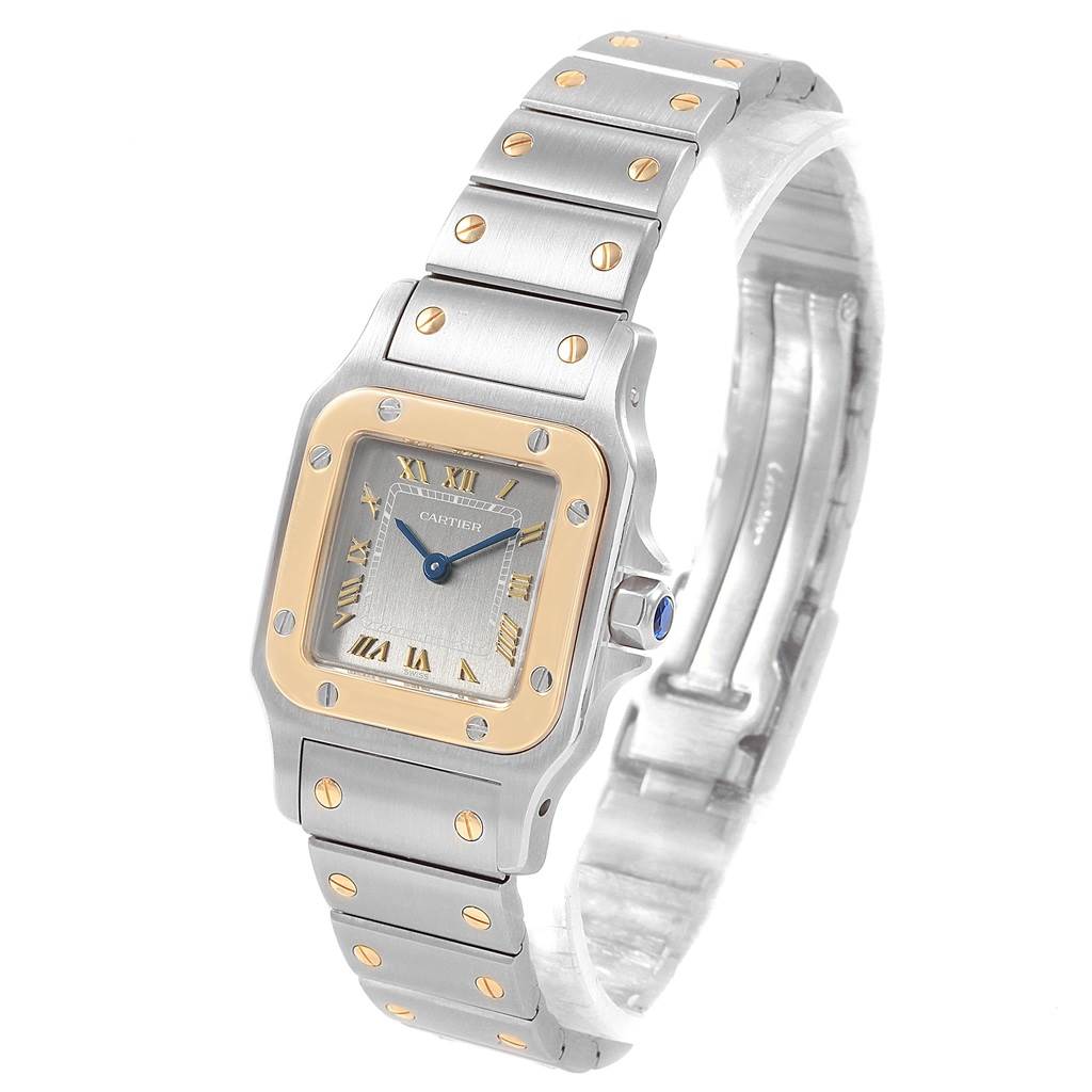 The image shows a Cartier Santos 1057930 Stainless Steel Grey Dial 1057930 Stainless Steel Grey Dial watch at an angled view, highlighting its dial, bezel, and bracelet.