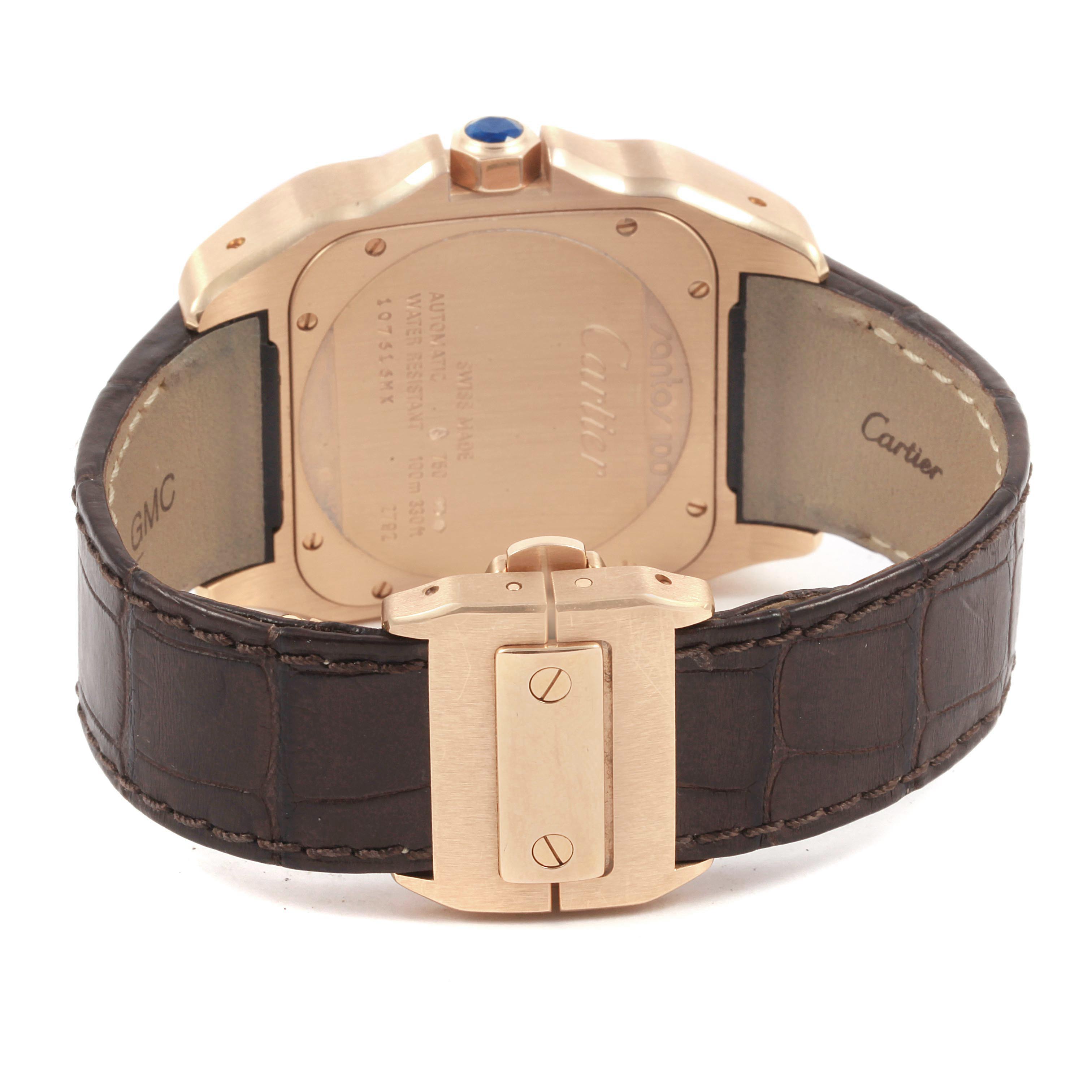 This Cartier Santos W20127Y1 Men's Rose Gold Brown Dial W20127Y1 Men's Rose Gold Brown Dial watch is shown from the back, displaying its case back, leather strap, and clasp.