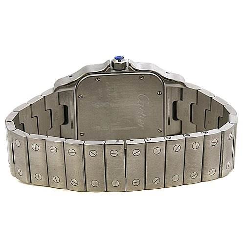This image shows the back view of a Santos model watch by Cartier, highlighting its metal bracelet and case back.
