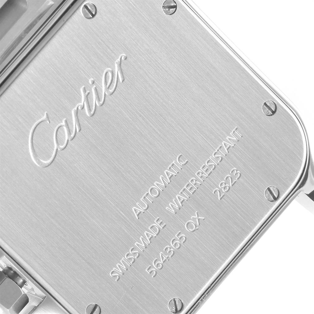 This image shows the back case of the Santos model watch by Cartier, engraved with branding and specifications.