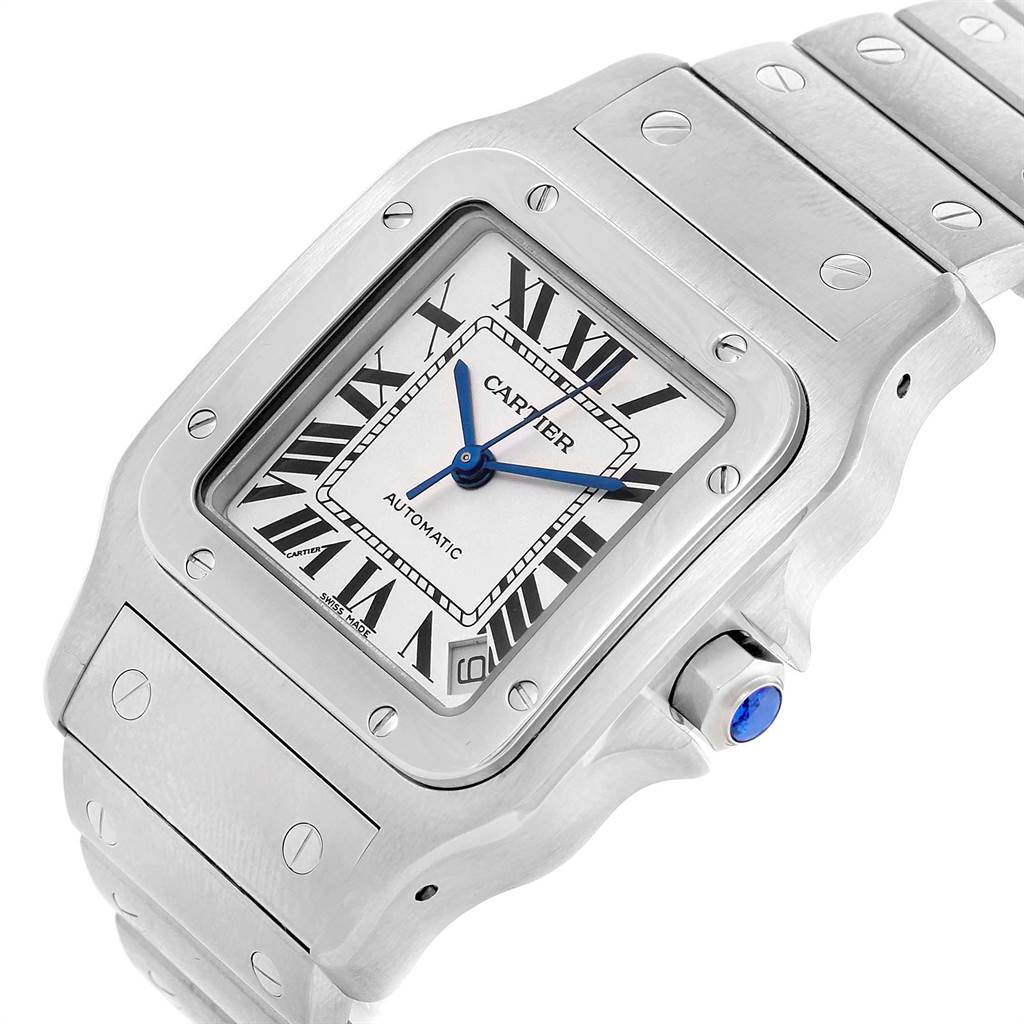 The image shows a close-up of the Cartier Santos W20098D6 Men's Stainless Steel Silver Dial W20098D6 Men's Stainless Steel Silver Dial watch dial, crown, and part of the metal bracelet at an angle.