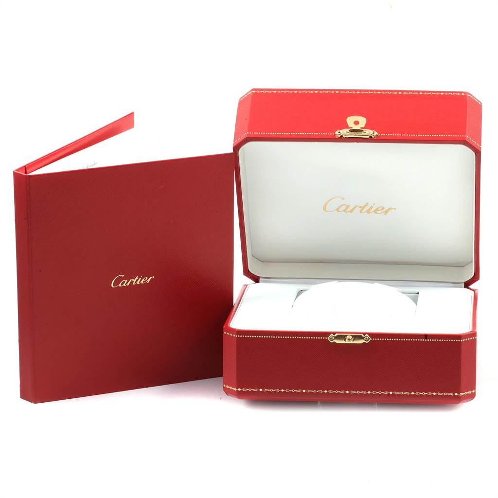 The image shows the open box and booklet for the Cartier Santos W20098D6 Men's Stainless Steel Silver Dial W20098D6 Men's Stainless Steel Silver Dial model watch.