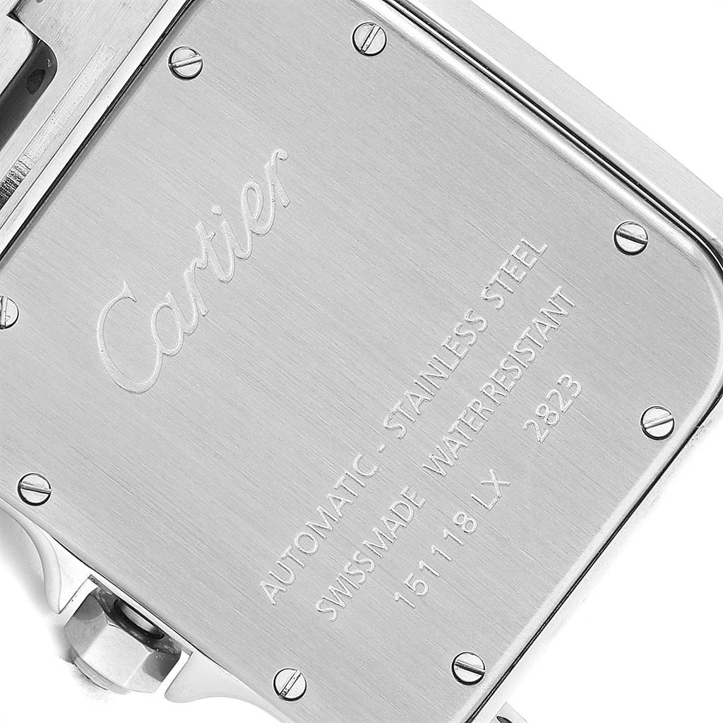 This image shows the engraved case back of the Santos model watch by Cartier from a close-up angle.