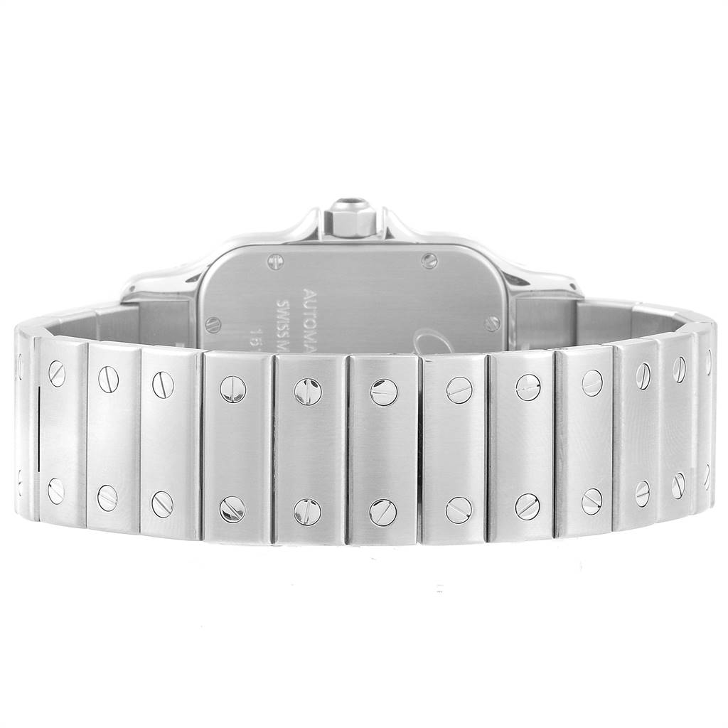 The image shows the backside and part of the metal bracelet of a Santos model by Cartier.