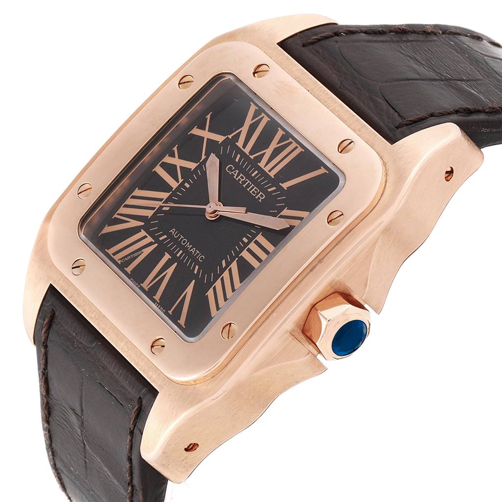 The image shows a close-up angle of the Santos model by Cartier, displaying the dial, bezel, crown, and part of the leather strap.