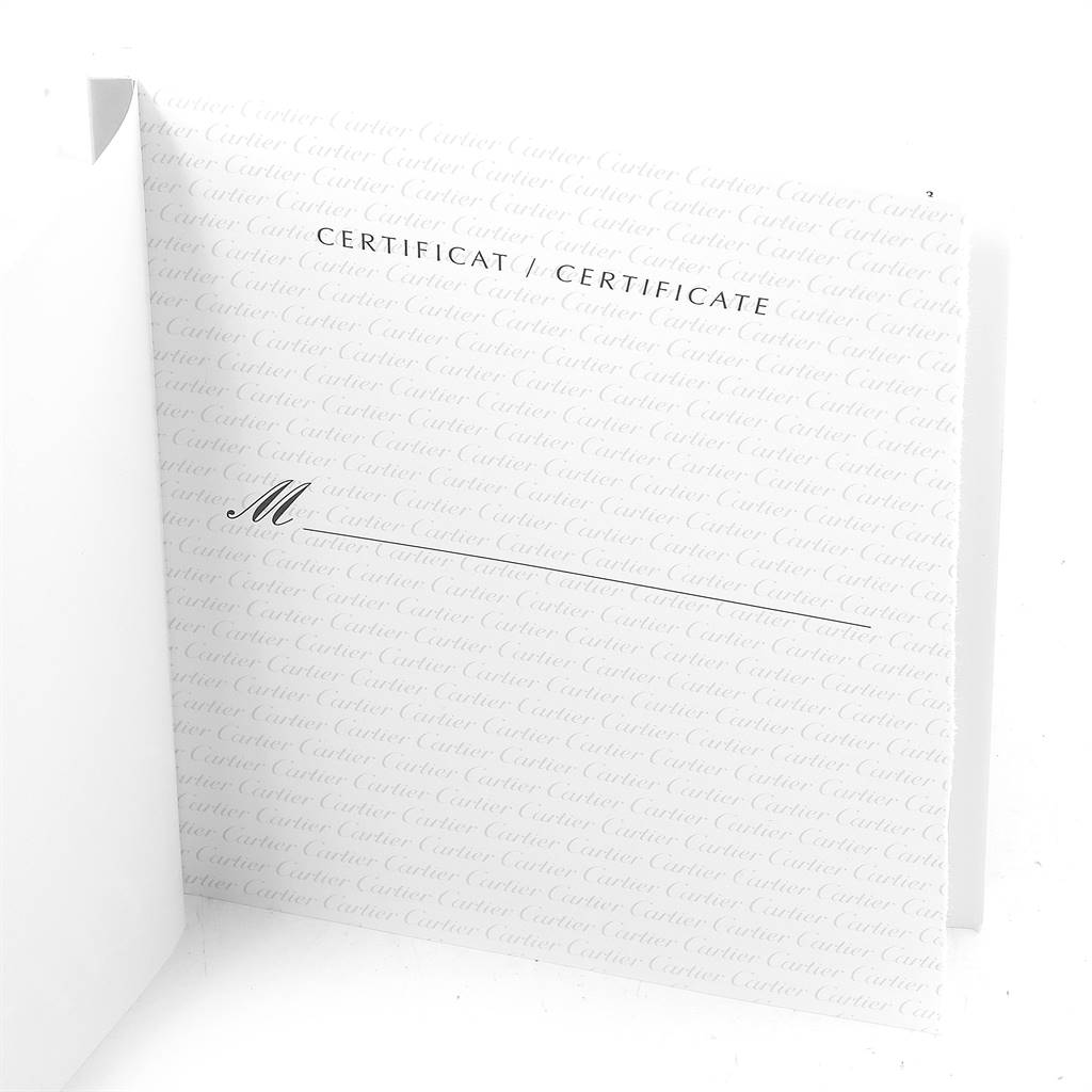 The image shows a partially opened certificate booklet for the Santos model by Cartier.