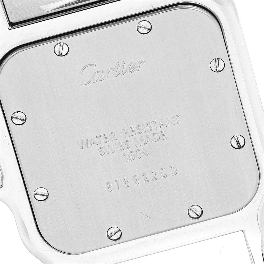 This image shows the back case of a Santos model by Cartier, highlighting the screws and inscriptions.