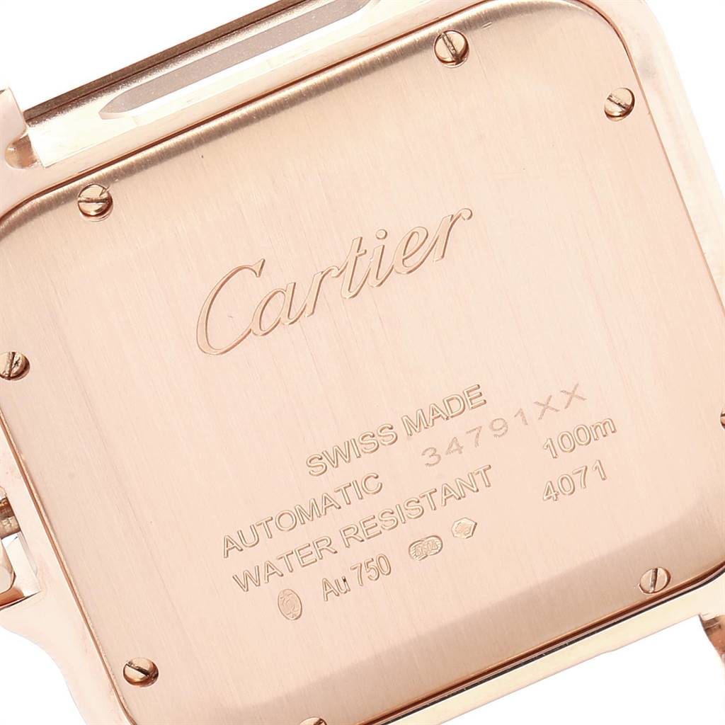 This image shows the back of the Santos model watch by Cartier, highlighting the engravings and screws.