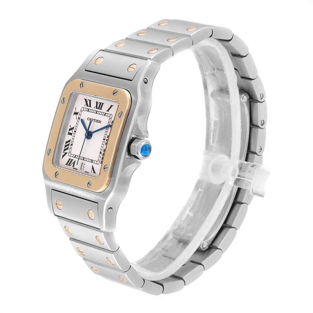 The Cartier Santos W20011C4 Stainless Steel Silver Dial W20011C4 Stainless Steel Silver Dial watch is shown from a side angle, displaying its face, bezel, and metal bracelet with gold accents.