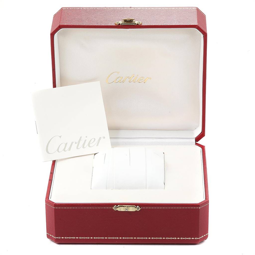 The image shows an open Cartier Santos W20098D6 Stainless Steel Silver Dial W20098D6 Stainless Steel Silver Dial watch box and accompanying manual, with the interior visible from the front angle.