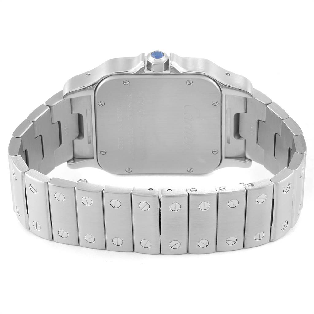 The image shows the back view of a Santos model by Cartier, focusing on the case back and metal bracelet.